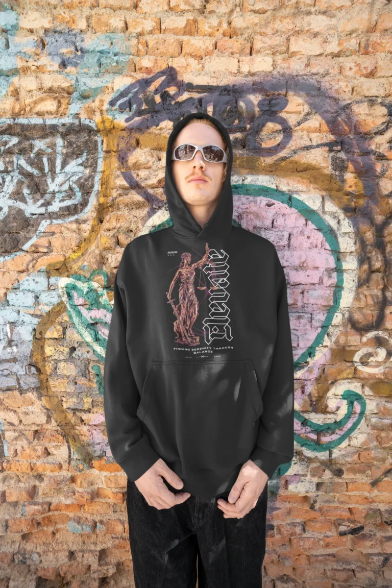 oversized-hoodie-mockup-featuring-a-man-posing-against-a-graffiti-wall-m39207